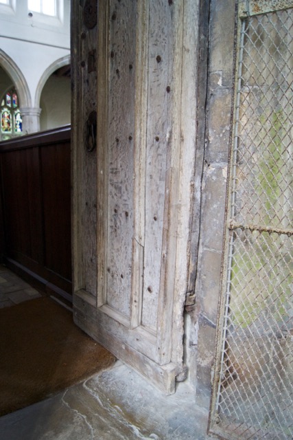 St George's Gt Bromley Essex 2015 repairs South door open, damaged hinge and rusty bird cage door 
