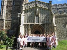 Newly-restored South Porch with pupils from St George's C of E School
