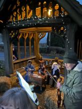 Crib Service 2021 at the lych gate with Mary, the ox, Joseph and the fiddler, Stephen